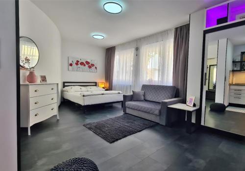 Ένα ή περισσότερα κρεβάτια σε δωμάτιο στο Modernes und gemütliches Studio in Karlsruhes Zentrum - APOLONIAliving