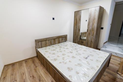 a bedroom with a bed in the corner of a room at Villa Ashtarak in Ashtarak