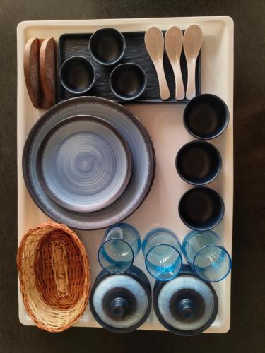 a tray with utensils and a plate and a spoon at Area 369 in Jaipur