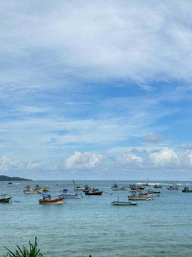 a group of boats sitting in the water at 234 Weligama in Pareiduwa