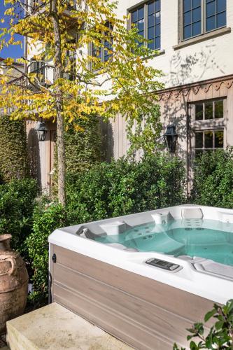 a jacuzzi tub in front of a building at The Notary in Bruges