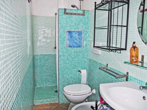 a bathroom with a toilet and a shower and a sink at Villa Giulia by Interhome in Sperlonga