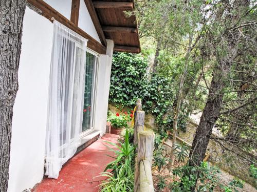 a porch of a house with a window at Villa Giulia by Interhome in Sperlonga