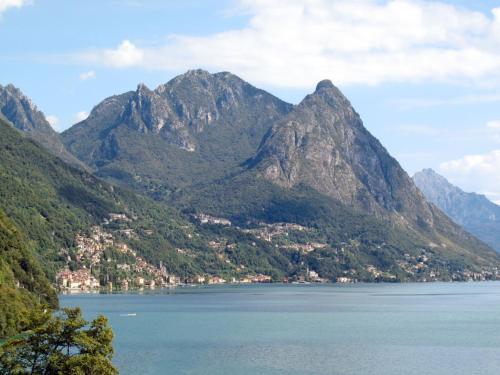 a view of a mountain range with a body of water at Apartment Miralago by Interhome in Oria