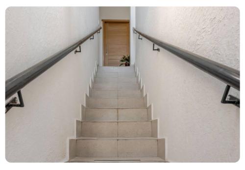a staircase leading to a door in a building at Casa Bacoba in Santa Marta