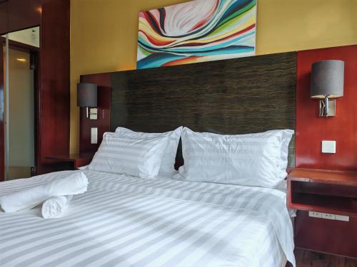 Katil atau katil-katil dalam bilik di Meetsuite at Ming Garden Residence