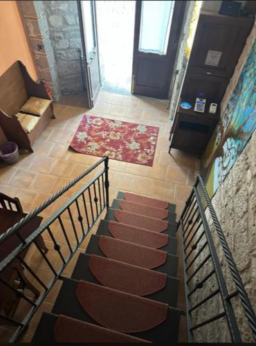 a staircase leading up to a room with a door at Affittacamere Al Piano in Trivento