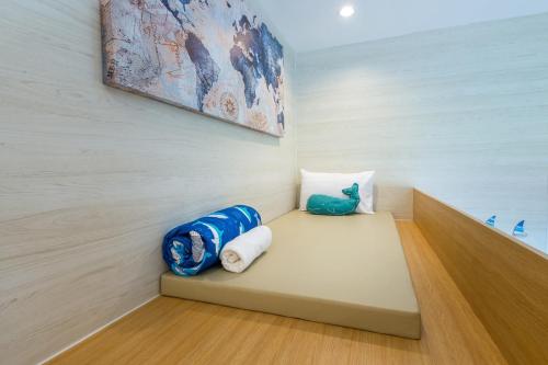 a room with a bench with a painting on the wall at Mada pool villa near Aonang beach in Ban Chong Phli