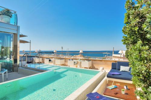 a swimming pool on top of a building at Palazzo del Corso – Boutique Hotel in Gallipoli