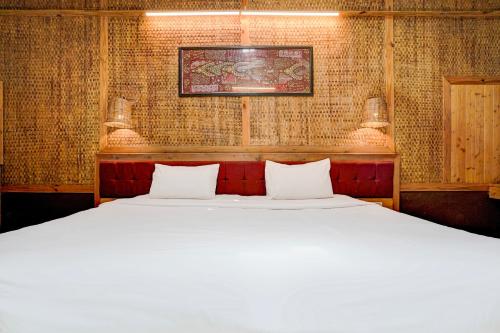 Postel nebo postele na pokoji v ubytování Palette Palghar Irayos Resort Lifestyle Retreat