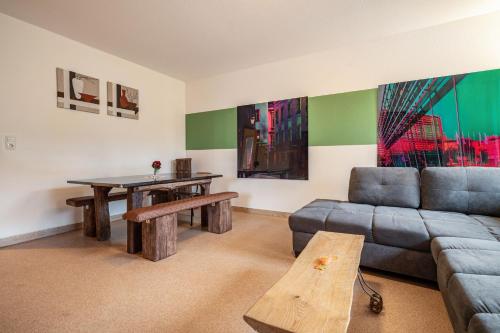 a living room with a couch and a table at Kolbatzer Mühle in Lychen