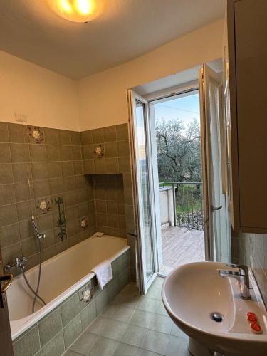 a bathroom with a tub and a sink at 1Dest - Arco Climbing in Arco