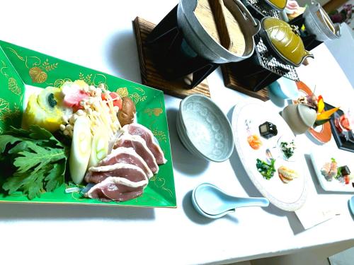 a green plate of food on a table at Chikurinin Gunpoen in Yoshino