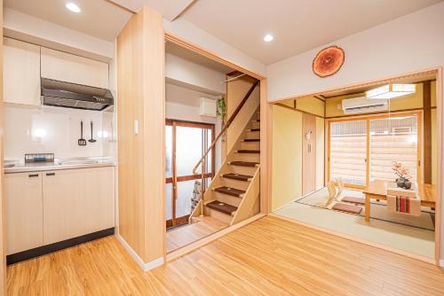 a kitchen and staircase in a tiny house at skytree Family Hotel in Tokyo