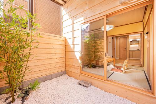 a room with a large window on the side of a house at skytree Family Hotel in Tokyo