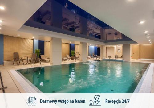 Bazén v ubytovaní GRANO APARTMENTS Gdańsk Motława SPA & Wellness alebo v jeho blízkosti