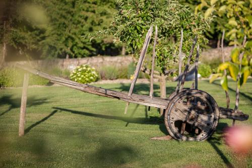 a wooden airplane sitting on the grass in a yard at Casas Novas Countryside Hotel Spa & Events in Chaves