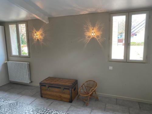 a room with two lights on the wall and a chair at AUTUN Maison 4 chambres 7/9 pers - cour ombragée proche commerces in Autun