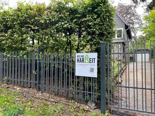 a sign on a fence with a make a harriet sign on it at Meine HarzZeit in Goslar