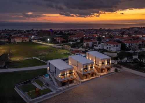 an aerial view of a house at sunset at Anore Luxury Suites in Nikiti