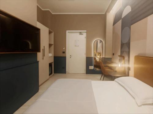 a bedroom with a bed and a flat screen tv at The B Place in Rome