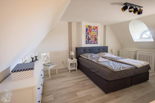 Ένα ή περισσότερα κρεβάτια σε δωμάτιο στο Hus op de Wurth Ferienwohnung Ruheinsel