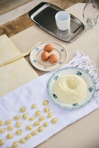 a table with two plates of eggs and a tray at Palazzo del Corso – Boutique Hotel in Gallipoli