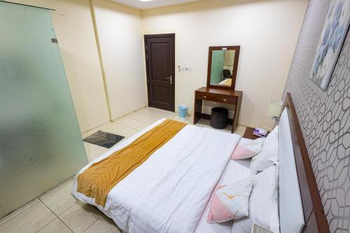 Postel nebo postele na pokoji v ubytování جوهرة الريان