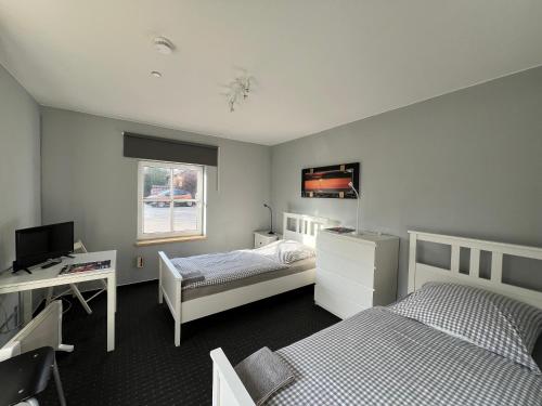 Una cama o camas en una habitación de Bett4-you Pinneberg