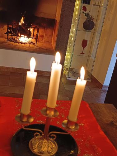 a group of candles on a table with a fireplace at Le 10&10 SPA idromassaggio in camera Nepi VT in Nepi