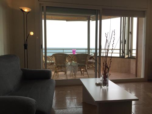 a living room with a couch and a table at Apartamento Rosendo in Calafell