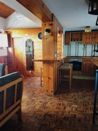 a kitchen with wooden cabinets and a counter top at Erbanova in Sila in Camigliatello Silano