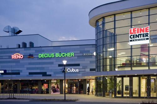 a store front of a building with a sign on it at Hannover - PHIL & MAX Hotels und Apartments Messe in Hannover