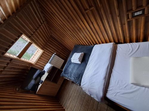 Letto o letti in una camera di Cabana cu trofee