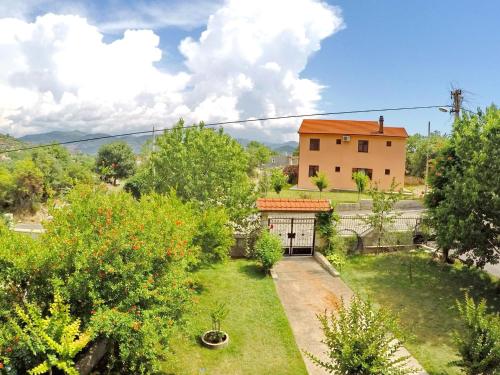 a view of a yard with a house at Apartments Pravica Trebinje in Trebinje