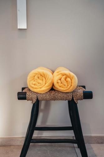a stool with three onion rings on it at 2BR LXRY Jansofat tropic oasis apt & pool in Willemstad