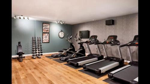 a gym with a bunch of exercise bikes in it at Hotel Indigo Coventry by IHG in Coventry