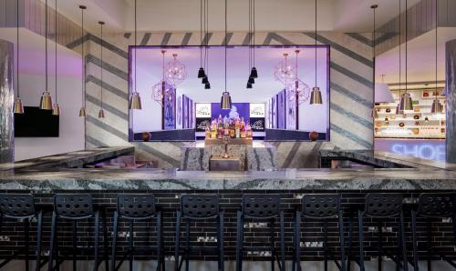 a view of the front counter of a restaurant with chairs at Sandals Royal Barbados All Inclusive - Couples Only in Christ Church