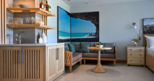 a living room with a couch and a table at Sandals Royal Barbados All Inclusive - Couples Only in Christ Church