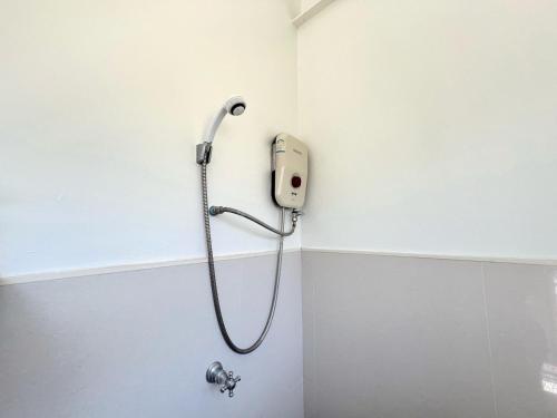 a shower in the corner of a bathroom at 3B Boutique Hotel in Chiang Mai