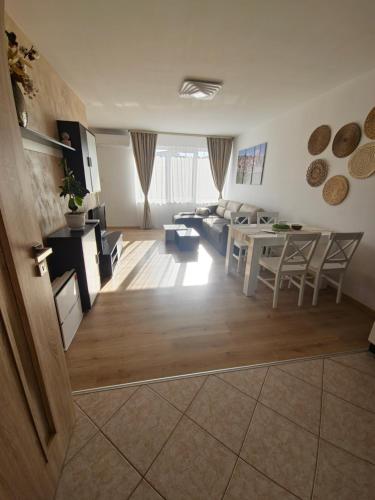 a large living room with a table and a couch at Perspective View in Veliko Tŭrnovo