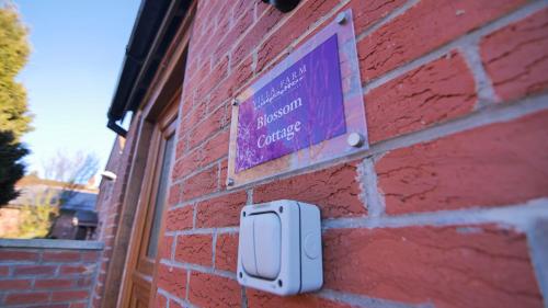 a sign on the side of a brick building at Villa Farm York in York