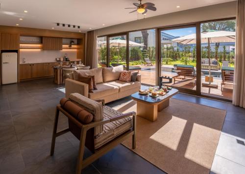 a living room with a couch and a table at Ethno Belek in Belek