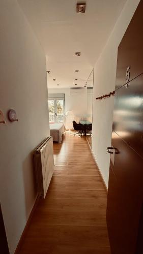 a hallway with a room with a bed and a table at Red House Bed & breakfast in Llucmajor