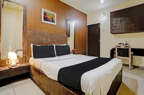 Ένα ή περισσότερα κρεβάτια σε δωμάτιο στο Hotel O Lotus Residency Near Anand Nagar Metro Station