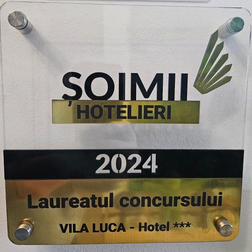 a sign that says sonilxualxualxualxualorenomalyomaly at VILA LUCA-Hotel in Şirnea