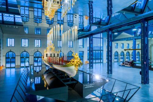 a museum with a boat sculpture in the middle of a building at The Originals Boutique, Hôtel de la Paix, Brest in Brest