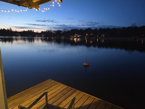 a view of a lake at night with a dock at MAD Family House in Spuntsiems