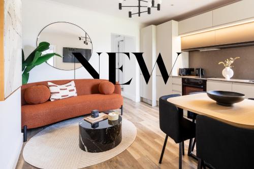 a living room with a couch and a table at Newly Designed, 2br Apt, 5min from Northwood London Tube Station, NATO HQ, Ideal for Wembley, Warner Studio, Contractors in Northwood