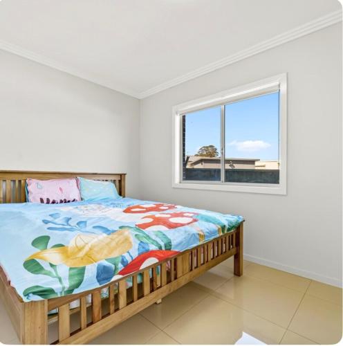 Postel nebo postele na pokoji v ubytování 2-bedroom Granny Flat